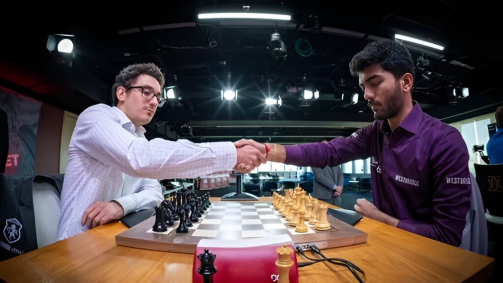 Indian Grandmaster D Gukesh shakes hands with American Grandmaster Fabiano Caruana before their chess match at the St. Louis tournament.